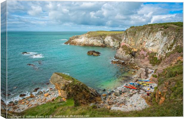 Rhoscolyn Bay Canoes Anglesey Wales Canvas Print by Adrian Evans
