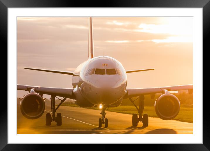 Airliner taxing out to the runway Framed Mounted Print by Jason Wells