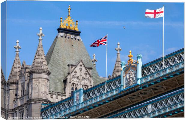 Flags on Tower Bridge in London Canvas Print by Chris Dorney