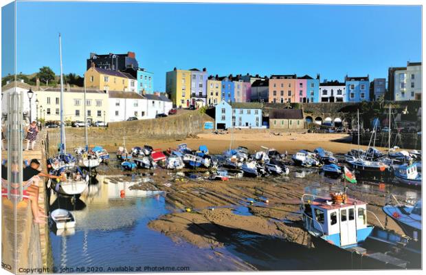 The beautiful colorful harbour of Tenby Wales at low tide. Canvas Print by john hill