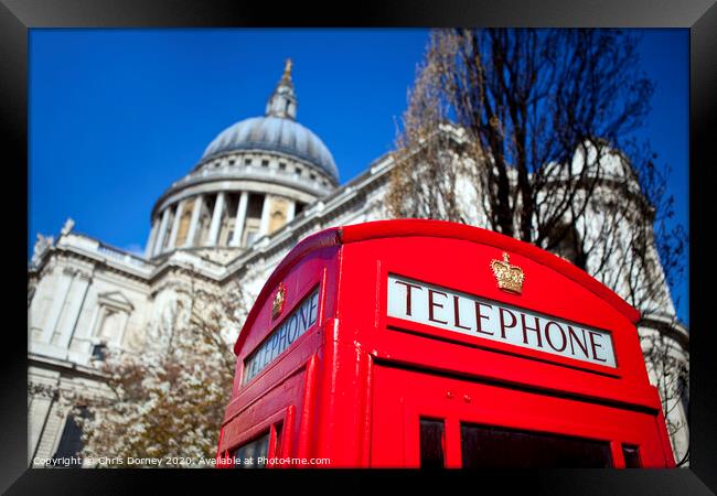 Red Telephone Box outside St. Paul's Cathedral in London Framed Print by Chris Dorney