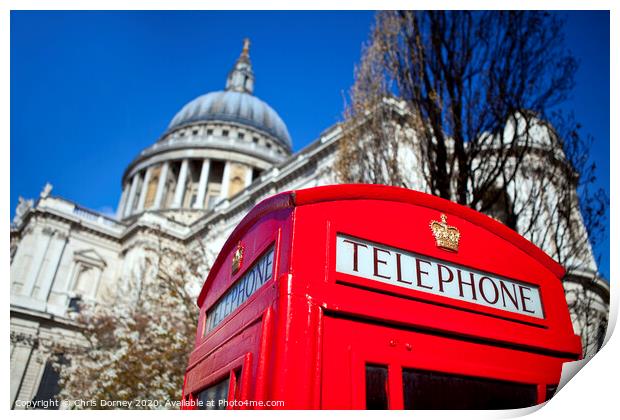 Red Telephone Box outside St. Paul's Cathedral in London Print by Chris Dorney