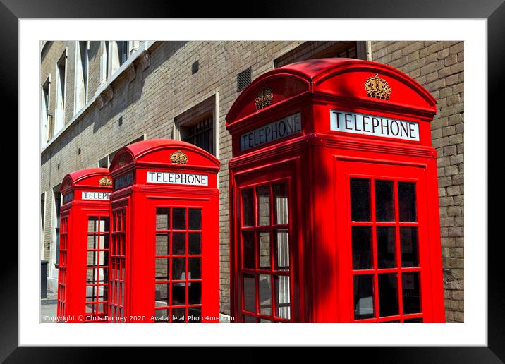 Red Telephone Boxes in London Framed Mounted Print by Chris Dorney