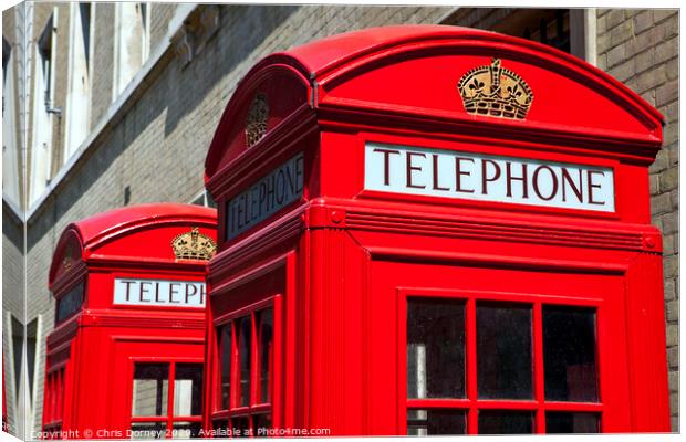 Red Telephone Boxes in London Canvas Print by Chris Dorney