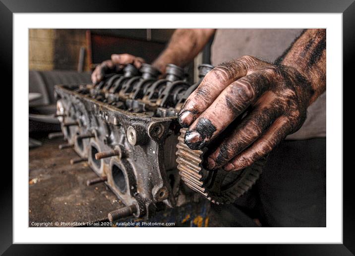 mam fixing a motor in a workshop Framed Mounted Print by PhotoStock Israel