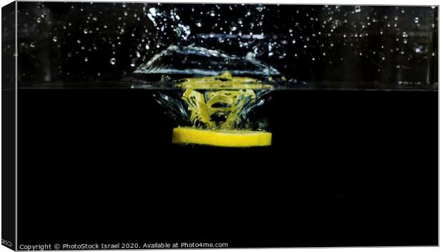 Lemon dropped into water  Canvas Print by PhotoStock Israel