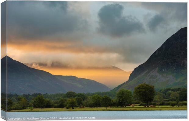 Stunning epic sunrise landscape image looking along Loweswater towards wonderful light on Grasmoor and Mellbreak mountains in Lkae District Canvas Print by Matthew Gibson