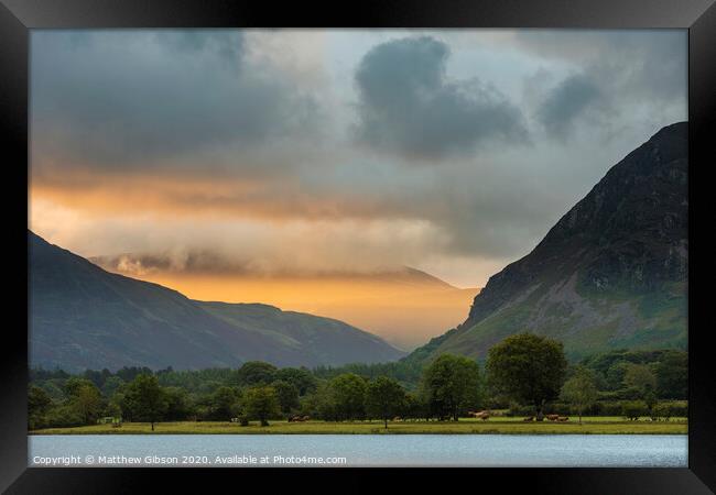 Stunning epic sunrise landscape image looking along Loweswater towards wonderful light on Grasmoor and Mellbreak mountains in Lkae District Framed Print by Matthew Gibson