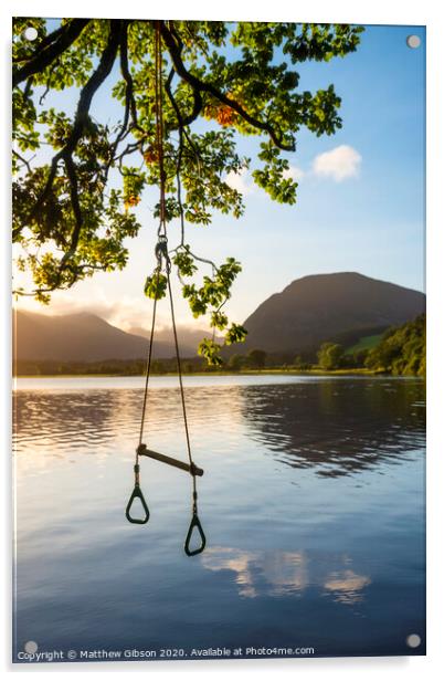 Quintessential beautiful English Summer landscape image of child's rope swing over calm lake in Lake District during golden Summer sunrise Acrylic by Matthew Gibson