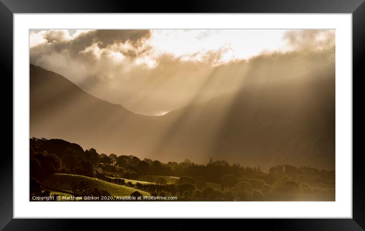 Epic golden light of sunrise on side of Low Fell in the English Lake District countryside during late Summer Framed Mounted Print by Matthew Gibson