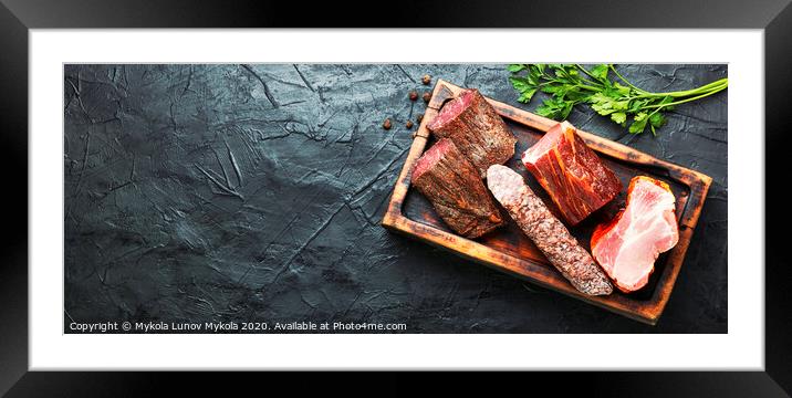 Chopping board of cured meat Framed Mounted Print by Mykola Lunov Mykola