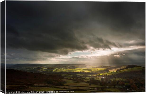 Beautiful sunbeams over Big Moor in the Peak District landscape in Autumn Canvas Print by Matthew Gibson