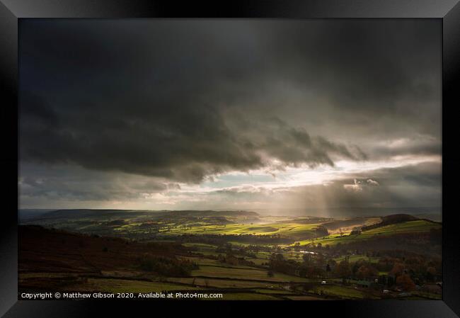 Beautiful sunbeams over Big Moor in the Peak District landscape in Autumn Framed Print by Matthew Gibson