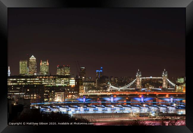 Beautiful landscape image of the London skyline at night looking along the River Thames Framed Print by Matthew Gibson