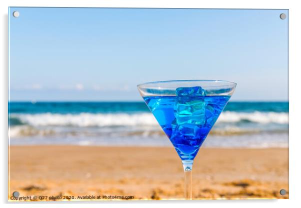 drink in a martini glass on the background of the waves affecting the sandy beach, relax on the beach, refreshing drink during the holidays Acrylic by Q77 photo