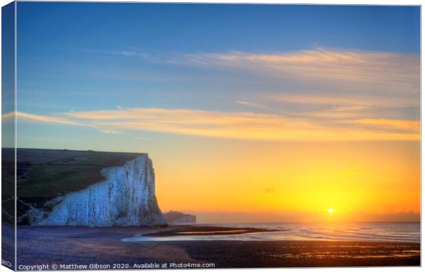 Stunning Winter landscape sunrise above the Seven Sisters cliffs Canvas Print by Matthew Gibson