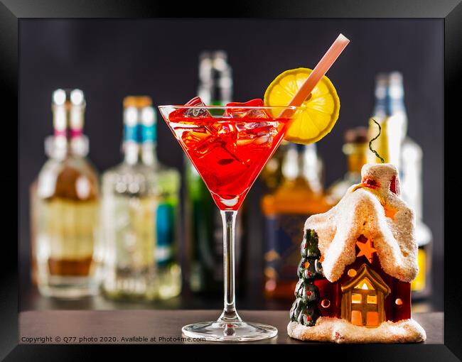 Coctail and beautiful Christmas house, candle, bottle background, xmas set Framed Print by Q77 photo