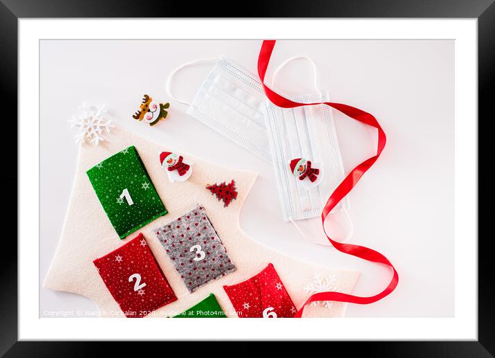 Christmas decoration isolated on white background with masks to avoid virus infections. Framed Mounted Print by Joaquin Corbalan