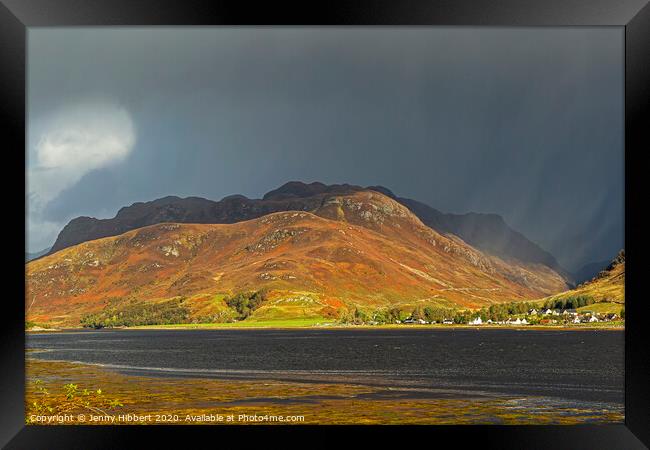 Overlooking Dornie with stormy light Framed Print by Jenny Hibbert