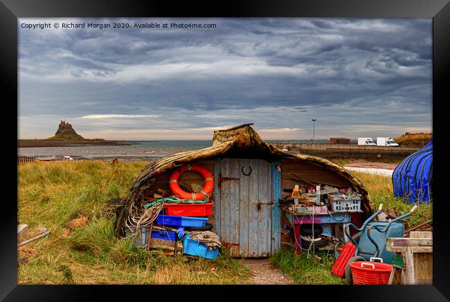 Upturned boats used as fishing shelters - on Holy Island. Framed Print by Richard Morgan