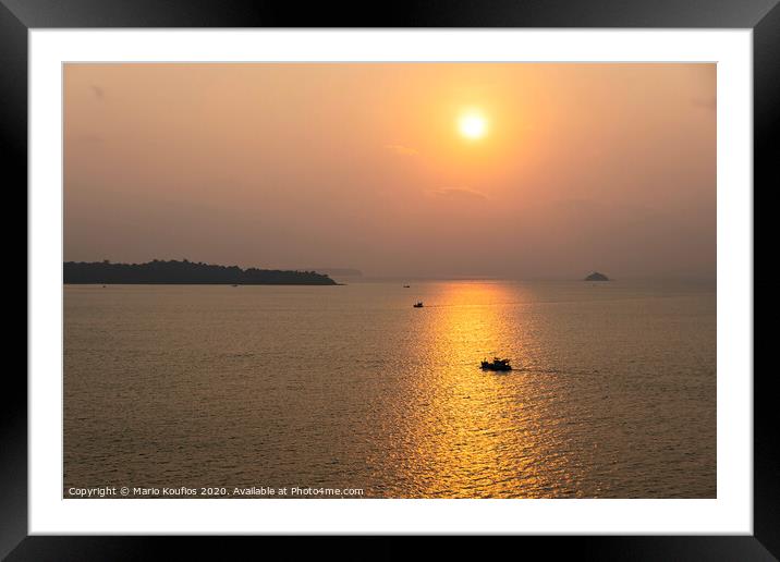 sunset with fishing boats in the vicinity singapore Framed Mounted Print by Mario Koufios