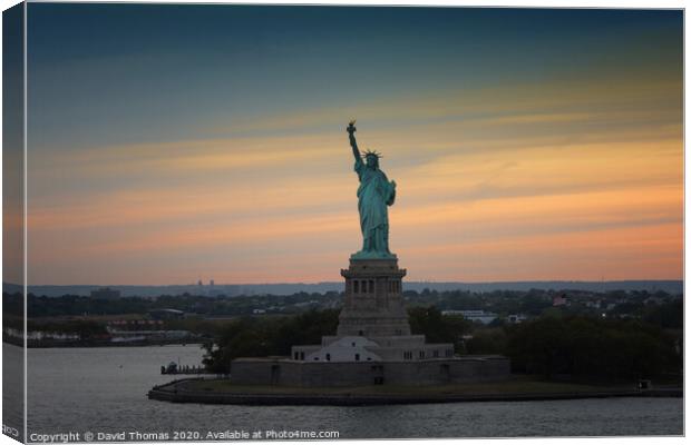 Majestic Sunset View of the Iconic Statue of Liber Canvas Print by David Thomas