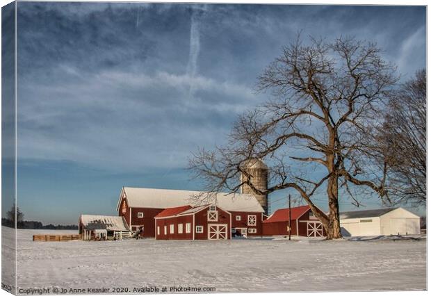 Red barn in the snow Canvas Print by Jo Anne Keasler