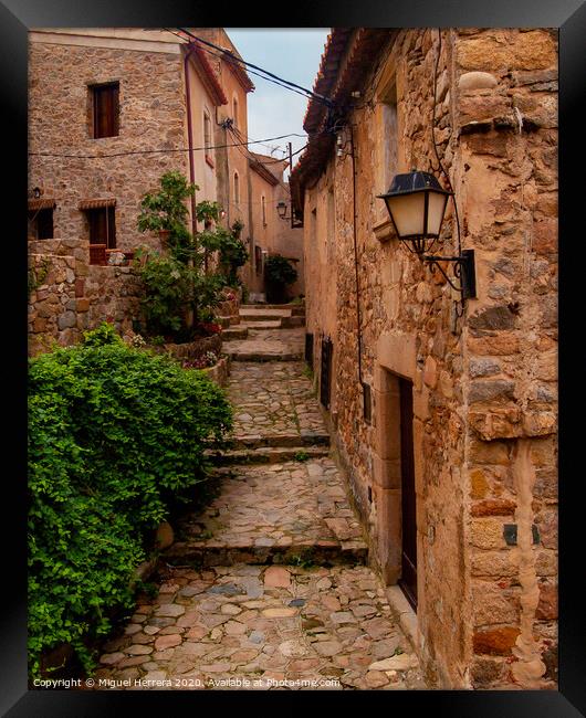Mediterranean cobbled medieval street - Tossa De Mar Framed Print by Miguel Herrera