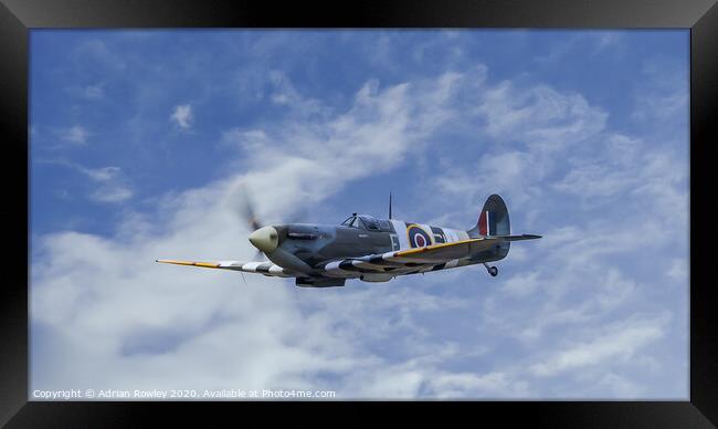 Spitfire in D-Day Colours Framed Print by Adrian Rowley