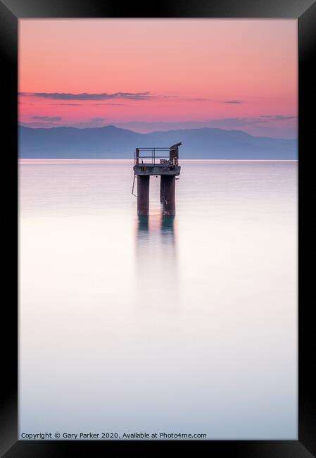 Solitary structure in a calm sea Framed Print by Gary Parker