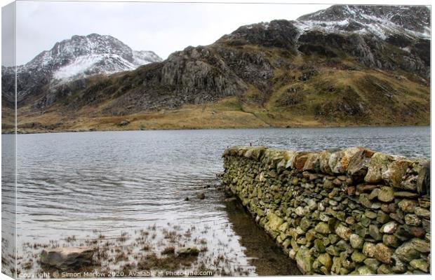 Majestic Llyn Idwal Peaceful Haven Amidst Snowdoni Canvas Print by Simon Marlow