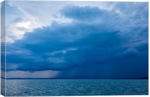 Big powerful storm clouds over the Lake Balaton of Hungary Canvas Print by Arpad Radoczy
