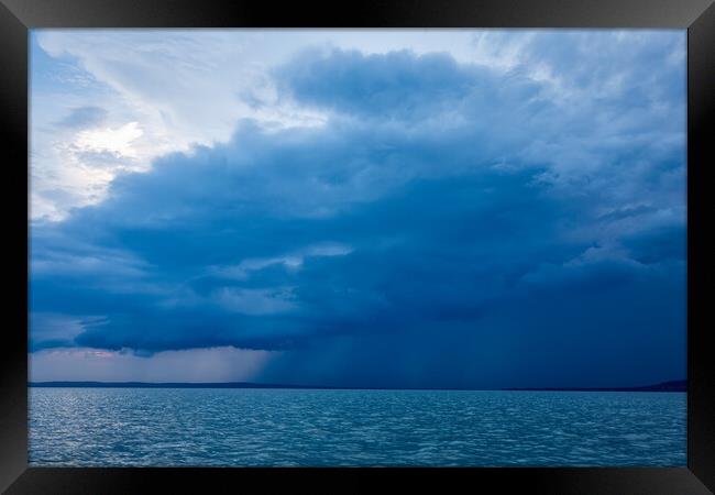 Big powerful storm clouds over the Lake Balaton of Hungary Framed Print by Arpad Radoczy