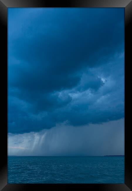 Big powerful storm clouds over the Lake Balaton of Hungary, typical summer shower Framed Print by Arpad Radoczy