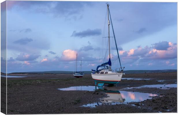 yachts moored on Instow beach at dusk Canvas Print by Tony Twyman