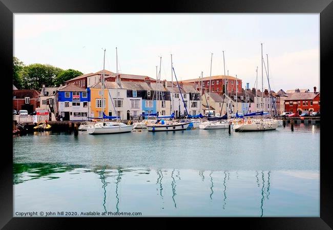 Yachts and reflections by the quay at Weymouth in Dorset. Framed Print by john hill