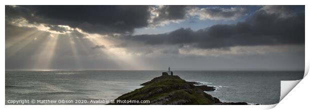 Landscape panorama of Mumbles lighthouse in Wales with sunbeams over sea Print by Matthew Gibson