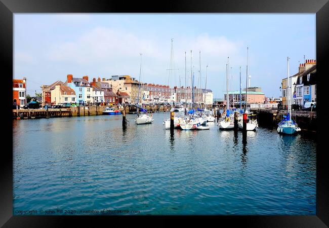 Sailing yachts at the habour side at Weymouth in Dorset. Framed Print by john hill