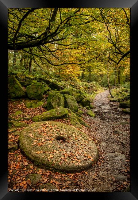Beautiful vibrant Autumn Fall forest landscape image of millstone in woodland in Peak District Framed Print by Matthew Gibson