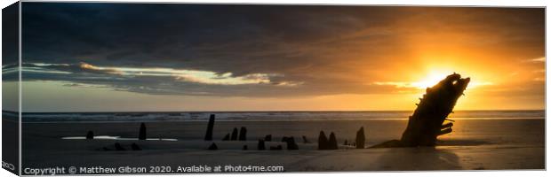 Landscape panorama ship wreck on Rhosilli Bay beach in Wales at sunset Canvas Print by Matthew Gibson