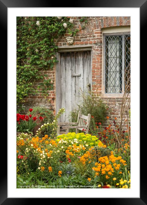 Quintessential vibrant English country garden scene landscape with fresh Spring flowers in cottage garden Framed Mounted Print by Matthew Gibson