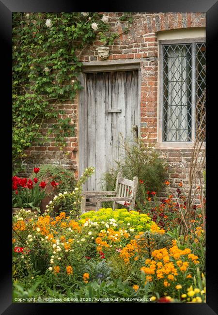 Quintessential vibrant English country garden scene landscape with fresh Spring flowers in cottage garden Framed Print by Matthew Gibson