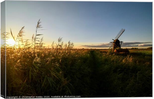 Golden hour at Herringfleet Windmill Canvas Print by Christopher Keeley