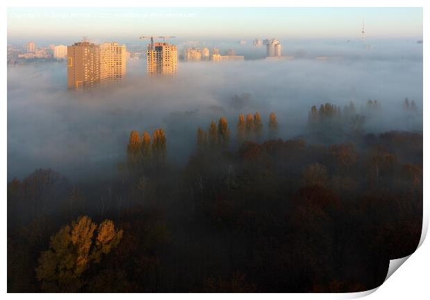 The sun's rays illuminate the morning city through the dense autumn fog Print by Sergii Petruk