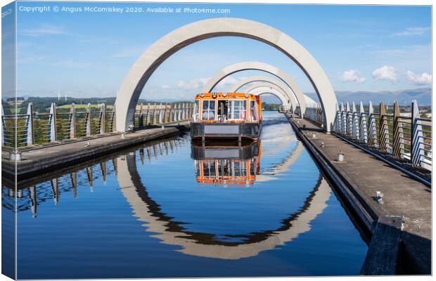 Canal boat leaving Falkirk Wheel Canvas Print by Angus McComiskey