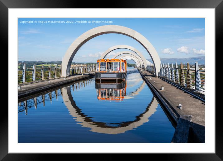 Canal boat leaving Falkirk Wheel Framed Mounted Print by Angus McComiskey