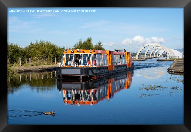 Canal boat leaving Falkirk Wheel behind Framed Print by Angus McComiskey
