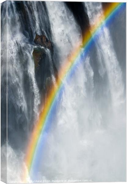 Rainbow amongst the mist, spray and cascading water of Victoria Falls, Africa Canvas Print by Mehul Patel