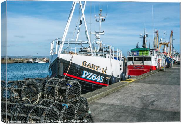 Trawlers moored up in Newlyn Harbour in Cornwall Canvas Print by Nick Jenkins
