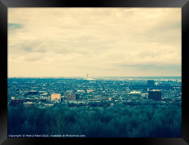 View of the city of Montreal with the Olympic Stadium (centre) in the distance, Montreal, Canada - cross process effect Framed Print by Mehul Patel
